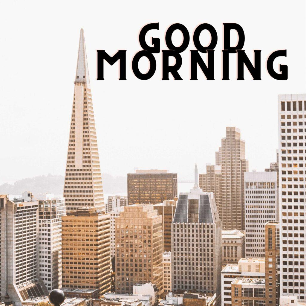 Lot of building and in between two buildings Written Good Morning