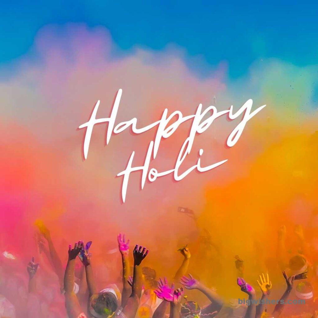 Multiple people are spreading colors in air written happy holi