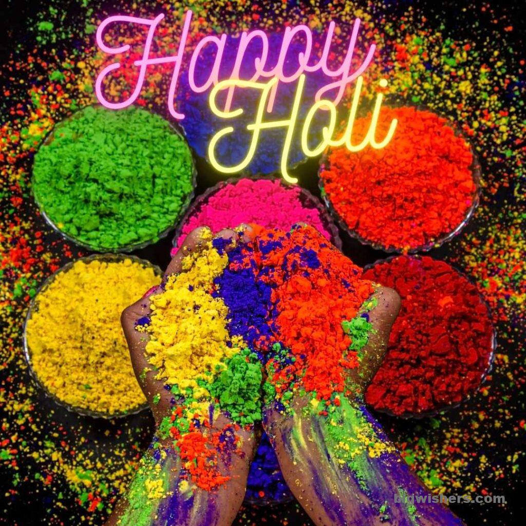 Red, Green, and Yellow color in hand and written happy holi