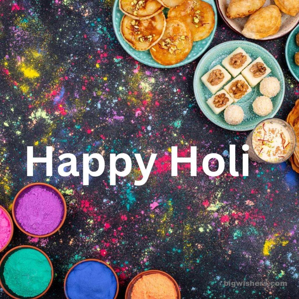 Sweets, Cakes and colour with written Happy holi
